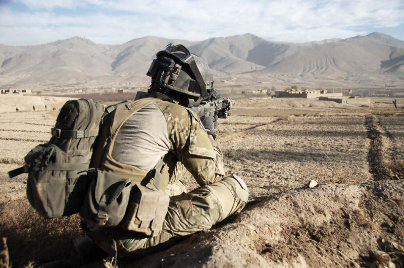 Soldier keeping watch over a possible enemy avenue of approach