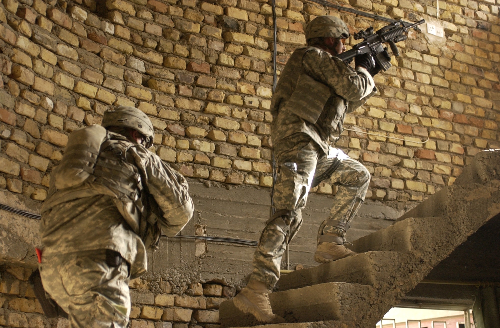 Soldiers assulting up a stairway.