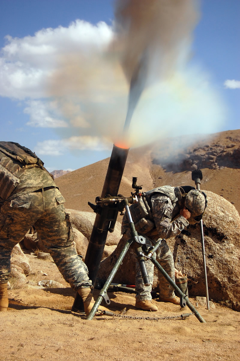 U.S. Soldiers fire 120mm mortars.
