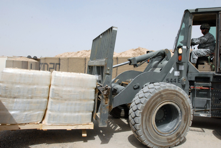 U.S. Soldier delivers pallets of water.