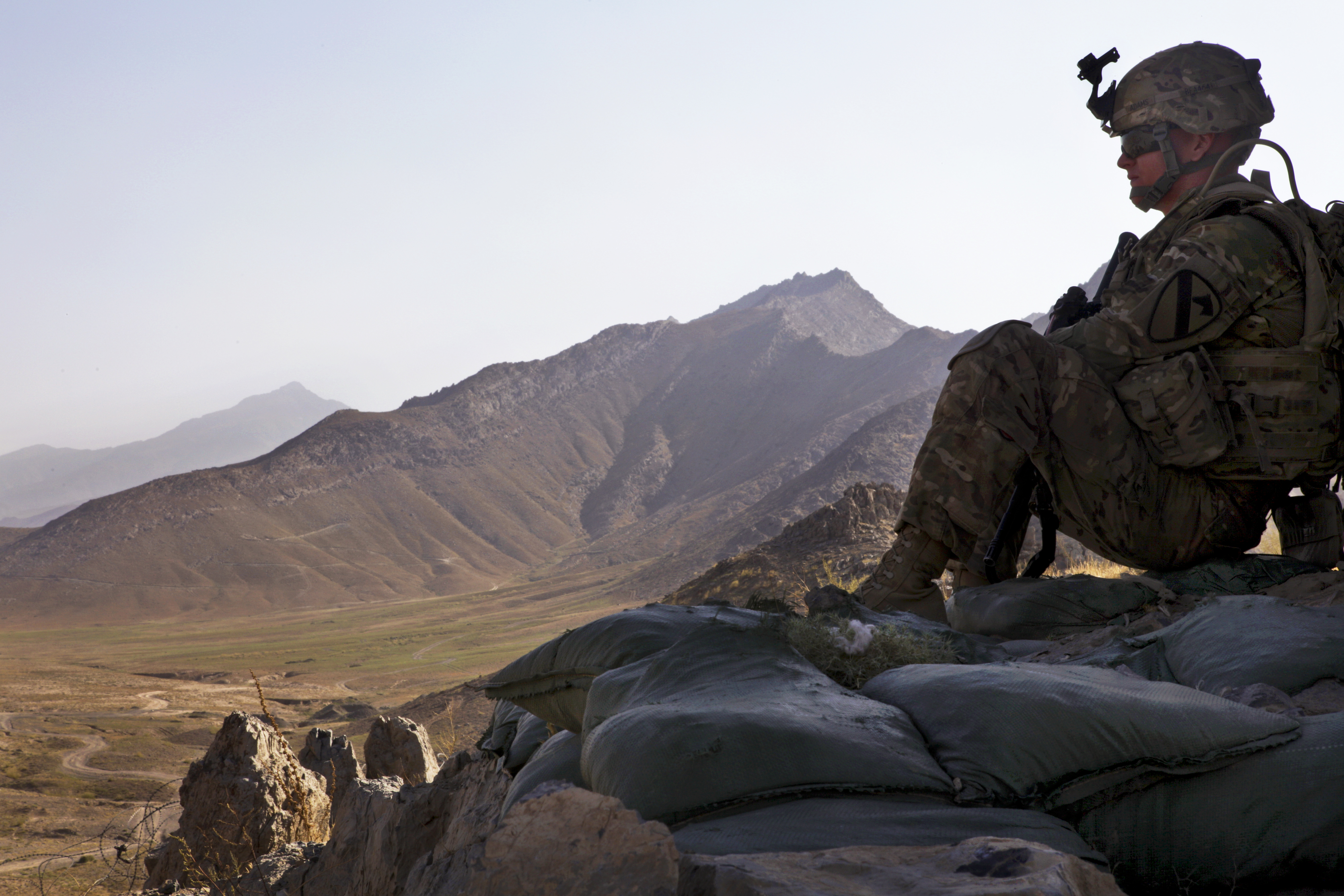 Soldier pulls security during a senior leader engagement.