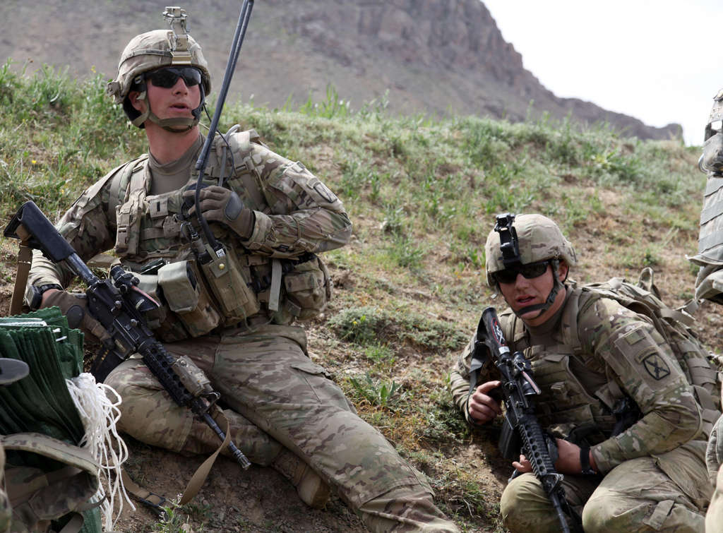 Soldiers take cover from enemy fire