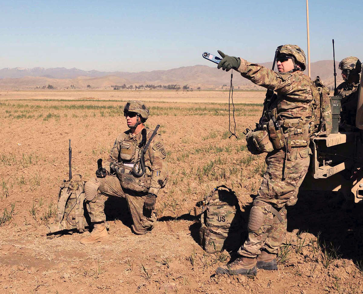 Soldiers dressed in appropriate camouflage